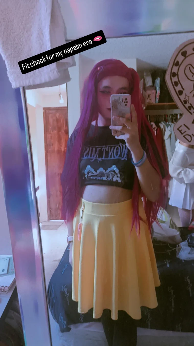 A mirror selfie I took cosplaying Mira with a caption saying "fit check for my napalm era".