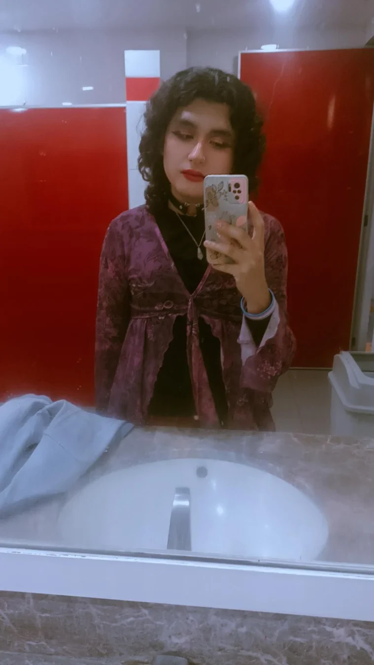 A selfie wearing a witchy purple boho blouse.