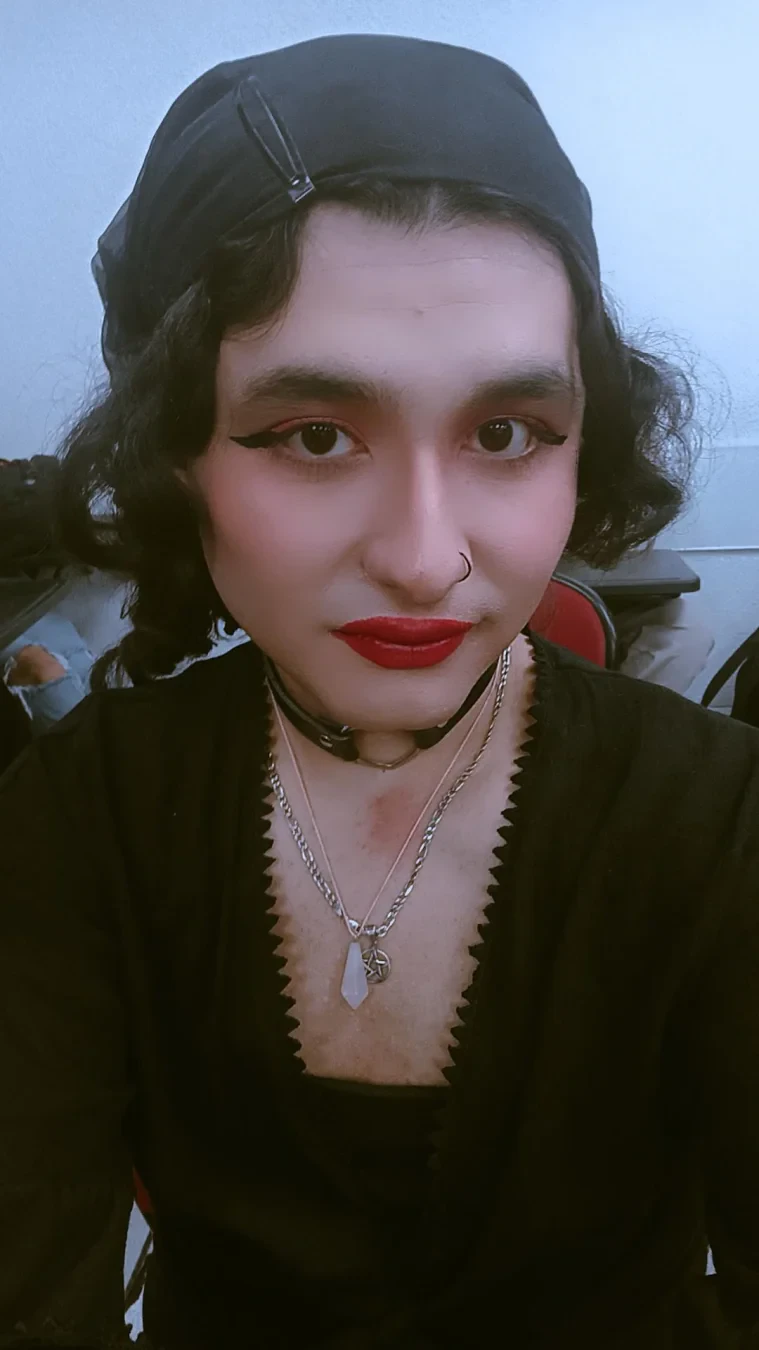 A selfie I took yesterday wearing a hippie-ish boho black top and a black headscarf.