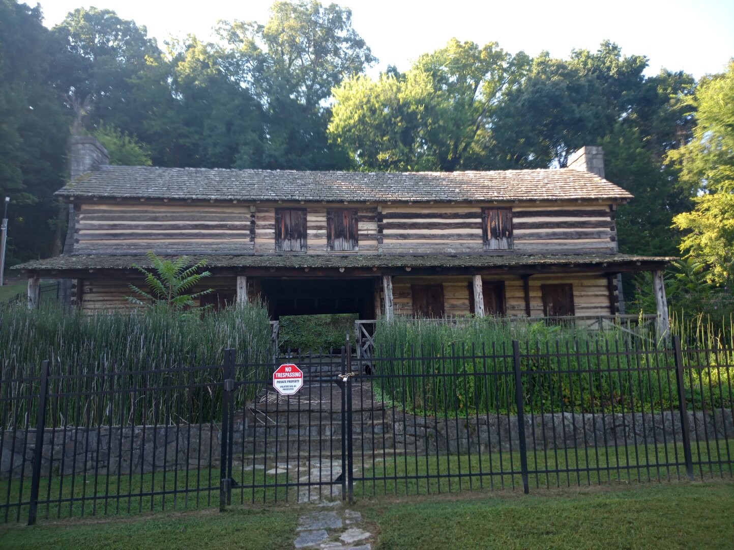 The view of a two story log cabin owned by the family of John Ross.